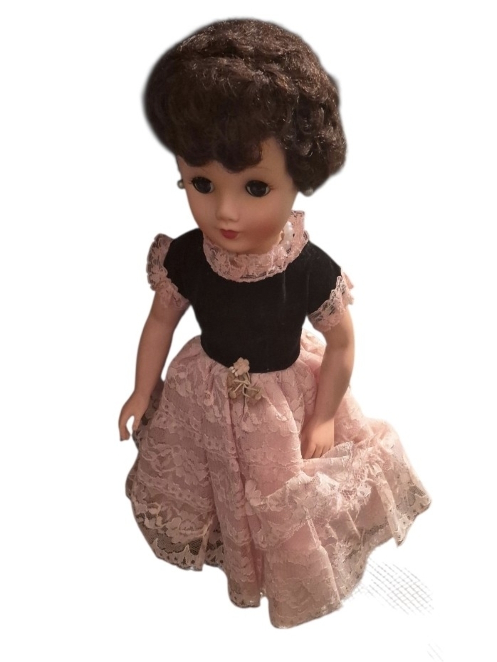 1950s doll with pink lace dress